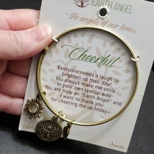 Earth Angel gold tone cheerful bracelet